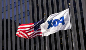 The American and Fox flags fly outside the News Corp. and Fox News headquarters in New York last week. (AP Photo/Mary Altaffer, File)