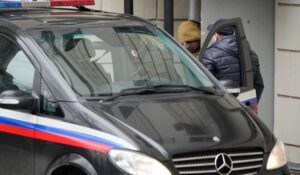 Reporter for the Wall Street Journal Evan Gershkovich is escorted by officers outside of court in Moscow on March 30. (AP Photo/Alexander Zemlianichenko)