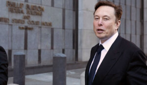 Elon Musk stands outside a courthouse in San Francisco in January. (AP Photo/ Benjamin Fanjoy, File)