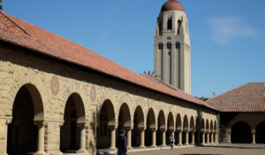 People walk on the Stanford University campus beneath Hoover Tower in Stanford, Calif., in 2019. (AP Photo/Ben Margot, File)