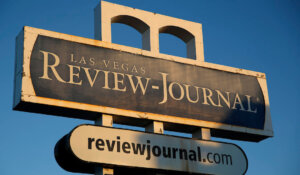 A sign for the Las Vegas Review-Journal is seen Thursday, Dec. 17, 2015, in Las Vegas. (AP Photo/John Locher)