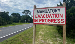 An evacuation sign in Cedar Key, Fla., on Tuesday as Hurricane Idalia barreled toward Florida's Gulf Coast. (AP Photo/Daniel Kozin)