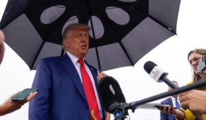 After his arraignment Thursday in Washington, former President Donald Trump speaks to the media on the tarmac at Ronald Reagan Washington National Airport. (AP Photo/Alex Brandon)