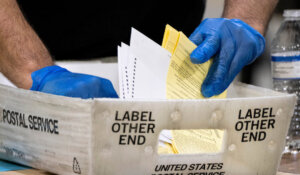 Georgia elections workers process absentee ballots. (AP Photo/Ben Gray)