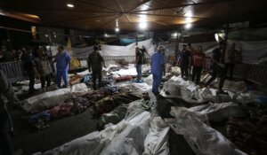 Bodies of Palestinians killed by an explosion at the Ahli Arab hospital are gathered in the front yard of the al-Shifa hospital, in Gaza City, central Gaza Strip on Tuesday. (AP Photo/Abed Khaled)