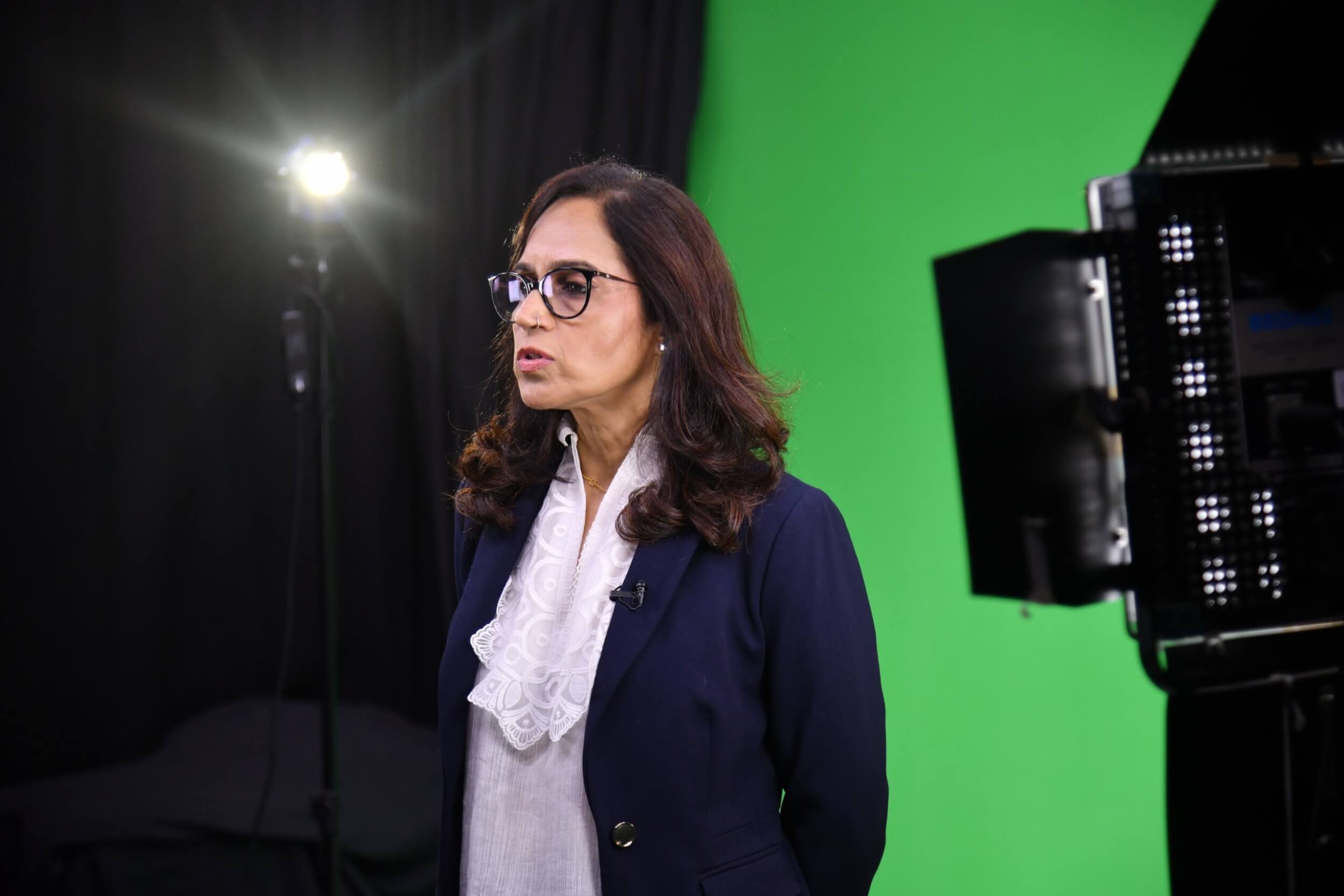 Ritu Kapur recording a video.