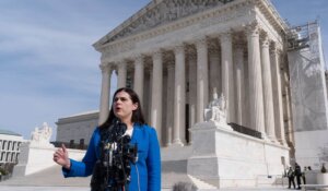 Colorado Secretary of State Jena Griswold speaks in front of the U.S. Supreme Court in Washington on Thursday. (AP Photo/Manuel Balce Ceneta)