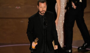 Mstyslav Chernov accepts the award for Best Documentary for "20 Days in Mariupol" during the Oscars on Sunday. (AP Photo/Chris Pizzello)