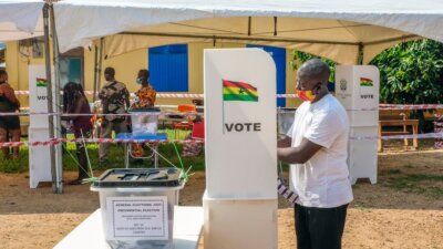 A voter casts his ballot at a polling station in Accra, Ghana, Monday, Dec. 7, 2020. (AP Photo/Ofoe Amegavie)