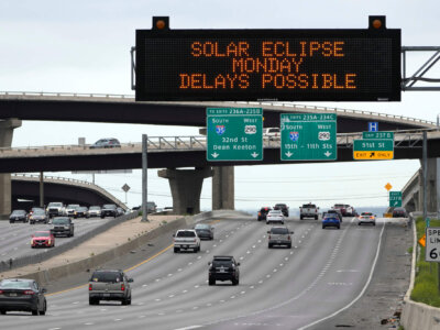 Motorists traveling toward Austin, Texas, are reminded of Monday's eclipse and the possibility of traffic delays Saturday, April 6, 2024, in Austin. (AP Photo/Charles Rex Arbogast)
