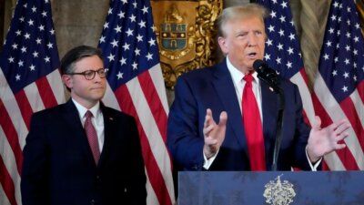 Republican presidential candidate former President Donald Trump speaks as Speaker of the House Mike Johnson, R-La., listens during a news conference, Friday, April 12, 2024, at Mar-a-Lago in Palm Beach, Fla. (AP Photo/Wilfredo Lee)