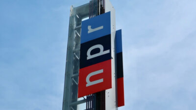 A sign at NPR's Washington, D.C., headquarters building in June 2019. (DCStockPhotography/Shutterstock)