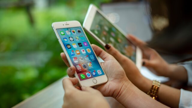 Udon Thani, Thailand October 21, 2018 : woman Using Apple iPhone. Young Influencer millennial Using Social Media on Smartphone, Like, Follower, Comment and share on internet social media.