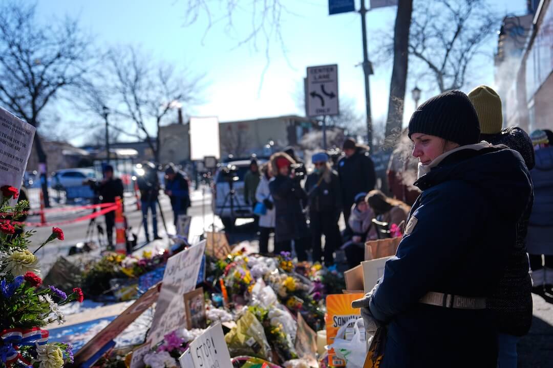 In most states, including Minnesota, carrying a gun at a protest is legal