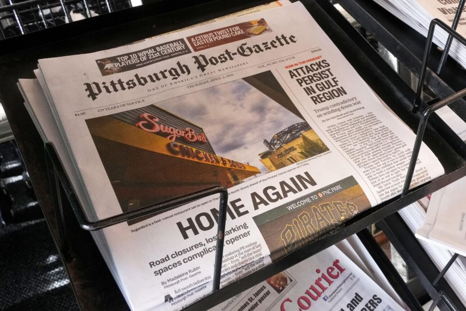 Photo of the front page of the Pittsburg Post-Gazette newspaper. The headline reads "HOME AGAIN"