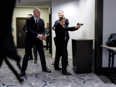 Members of law enforcement respond during the White House Correspondents Dinner, Saturday, April 25, 2026, in Washington. (AP Photo/Tom Brenner)